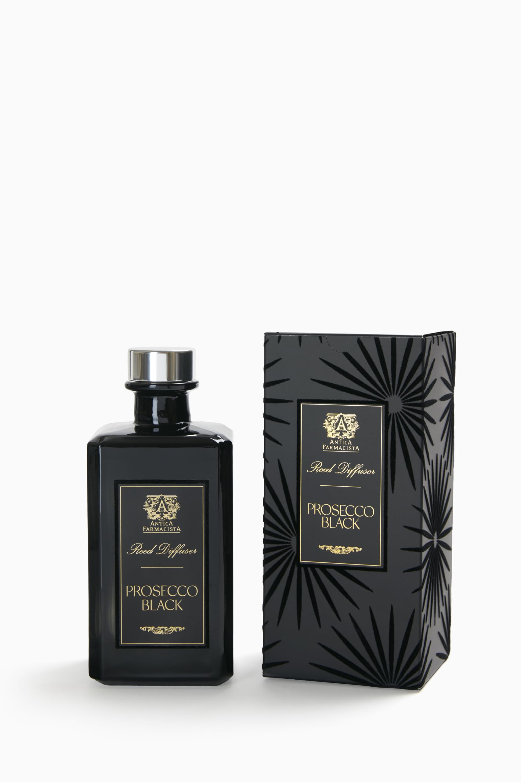 Close-up of Prosecco Black reed diffuser bottle with reeds