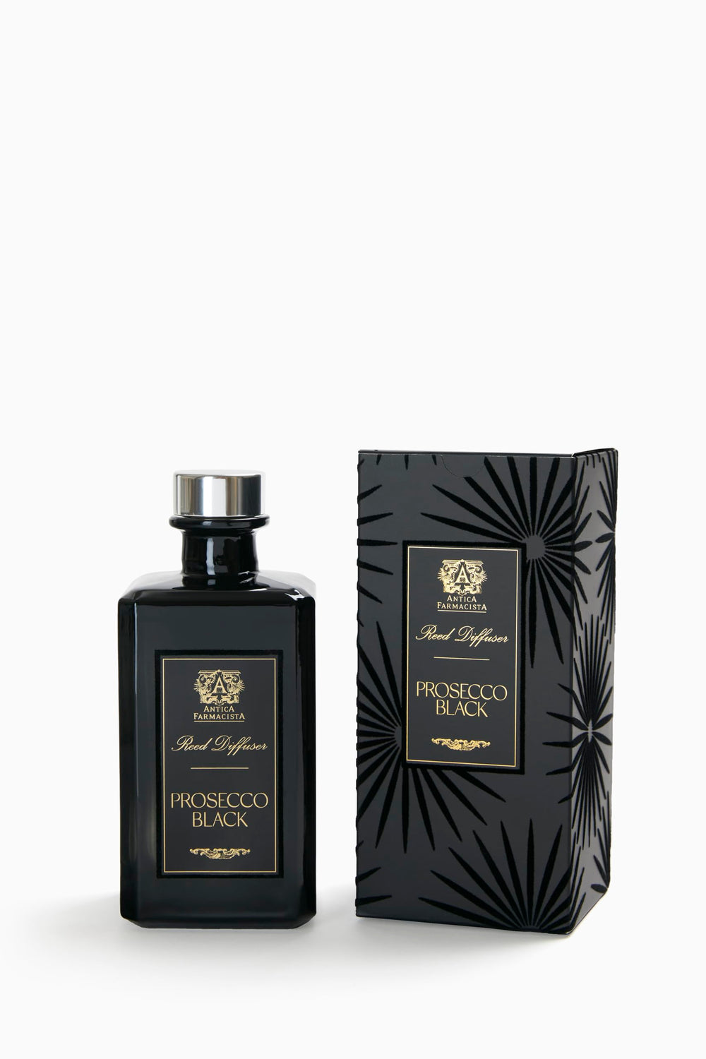 Close-up of Prosecco Black reed diffuser bottle with reeds