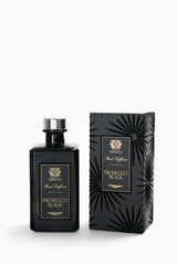 Close-up of Prosecco Black reed diffuser bottle with reeds