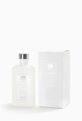 Antica Farmacista White Spruce diffuser with reeds in glass bottle