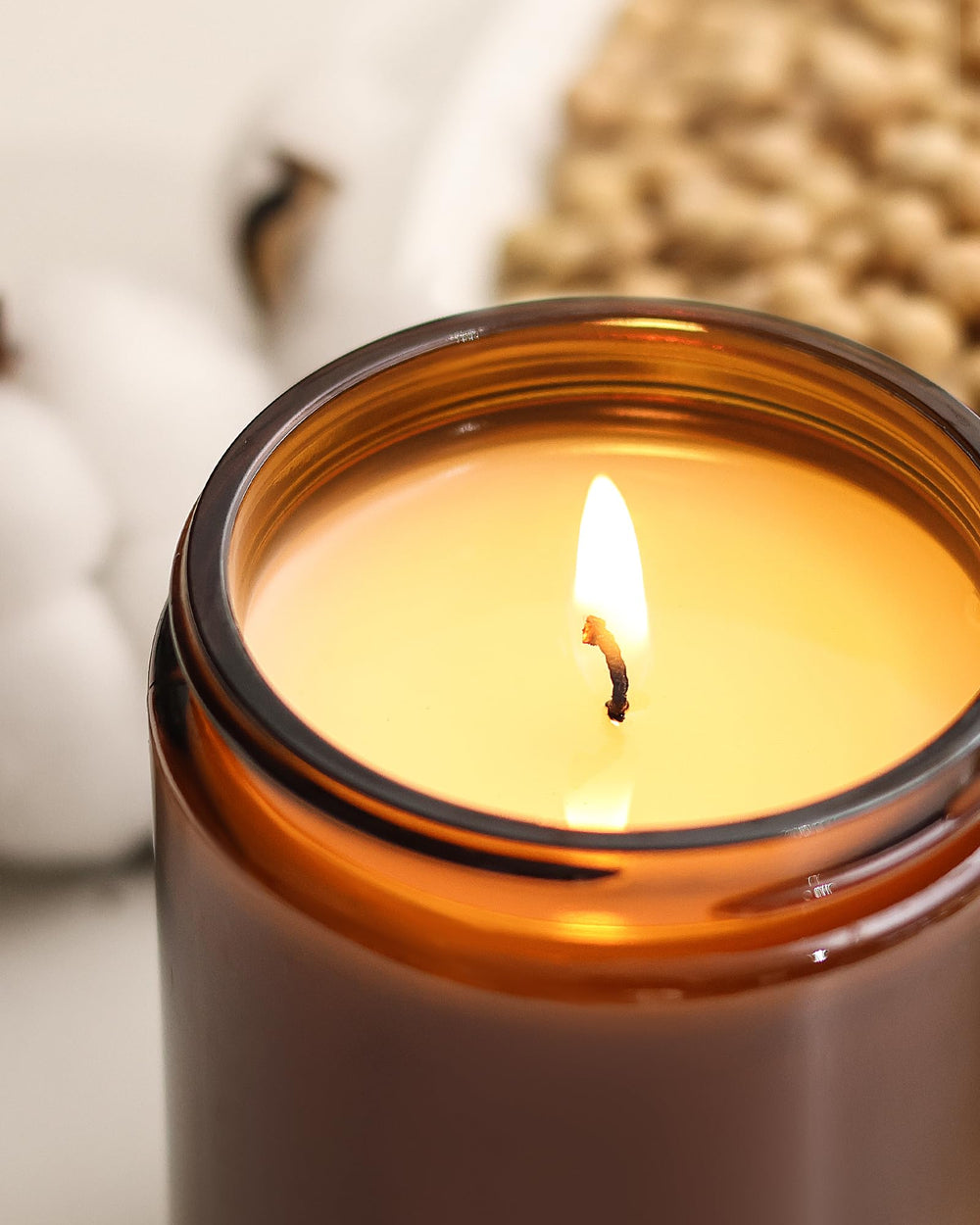 AOOVOO candle beside a ruler showing 22 oz scale benefit: long burn time