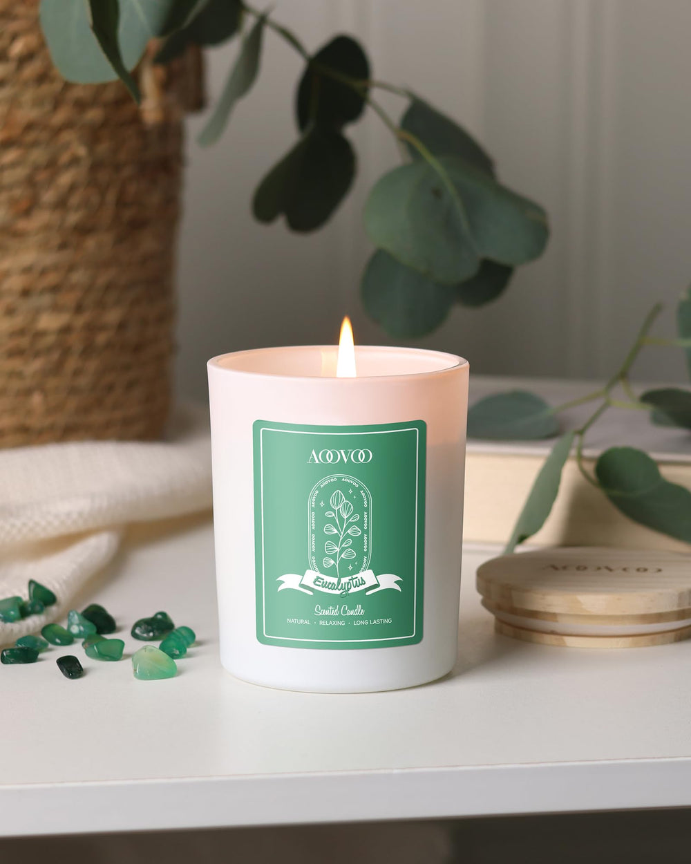AOOVOO 7oz candle held for scale demonstrating compact long-lasting size