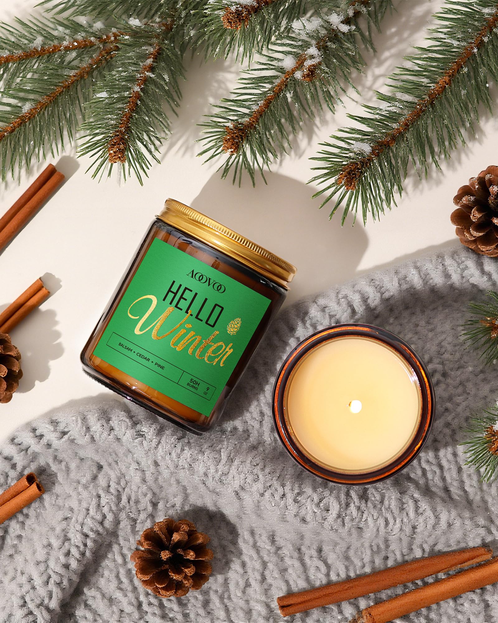 Close-up of pine-scented candle in Glass jar with pine needles