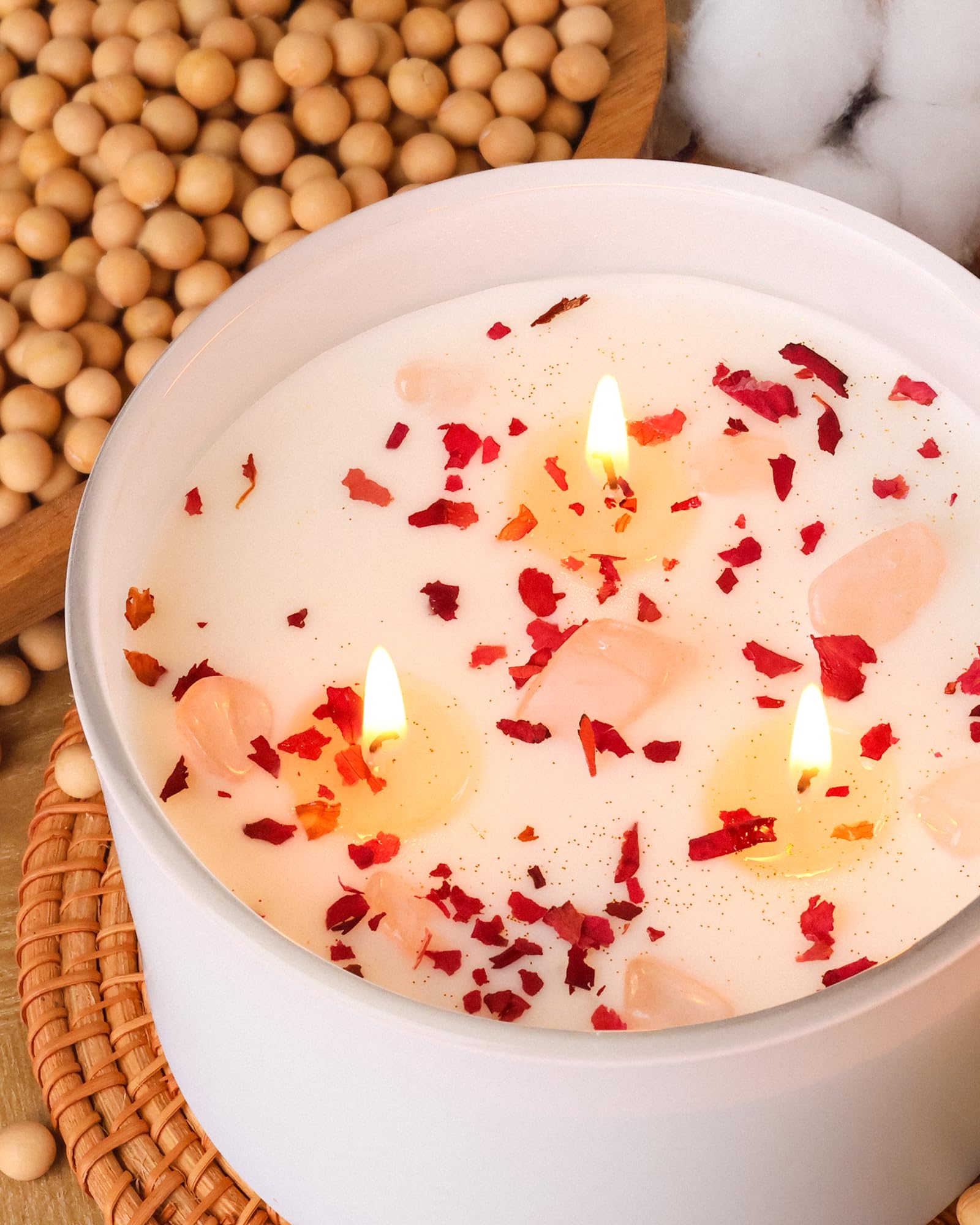 Candle topped with dried rose petals and gold foil
