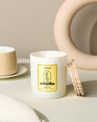 Close-up of vanilla candle with crystals and floral notes