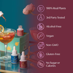 Flat lay of three bottles with botanicals and soft pink backdrop