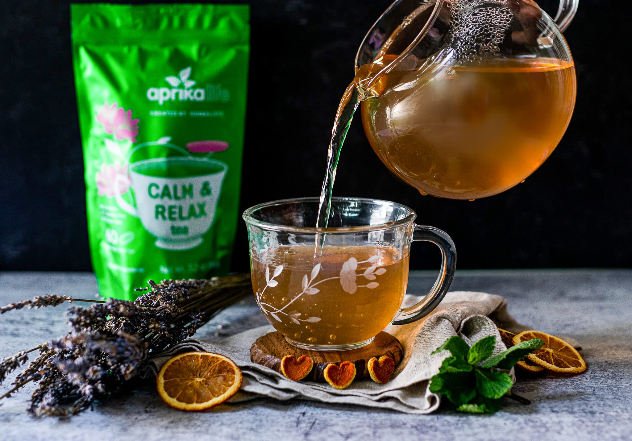 Cup with CalM & Relax tea and fresh herbs (chamomile, peppermint, lavender)