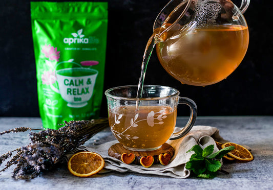 Cup with CalM & Relax tea and fresh herbs (chamomile, peppermint, lavender)