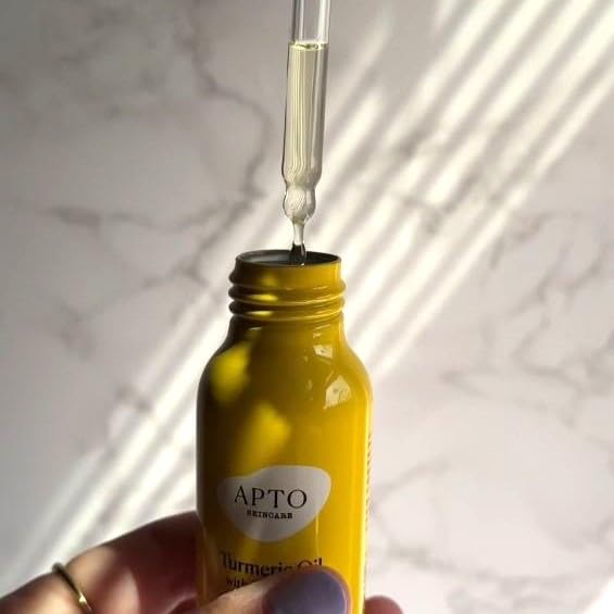APTO Turmeric Oil with Rosemary packaging close-up emphasizes sustainable packaging.