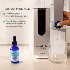 Pipette dispensing AquaTru Perfect Minerals into water