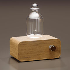 Aria diffuser with glass body and handmade wood base close-up