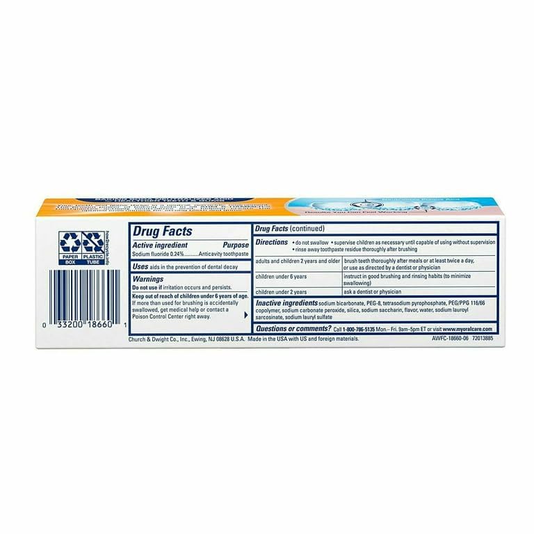 Close-up of toothpaste tube dispensing on white background