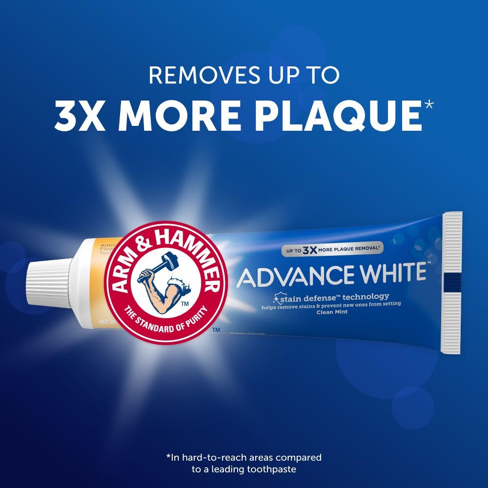 Minty whitening paste on a toothbrush showing foam