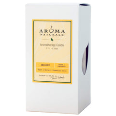 Ambiance image of Aroma Naturals orange and lemongrass scented pillar candle, handmade in the USA