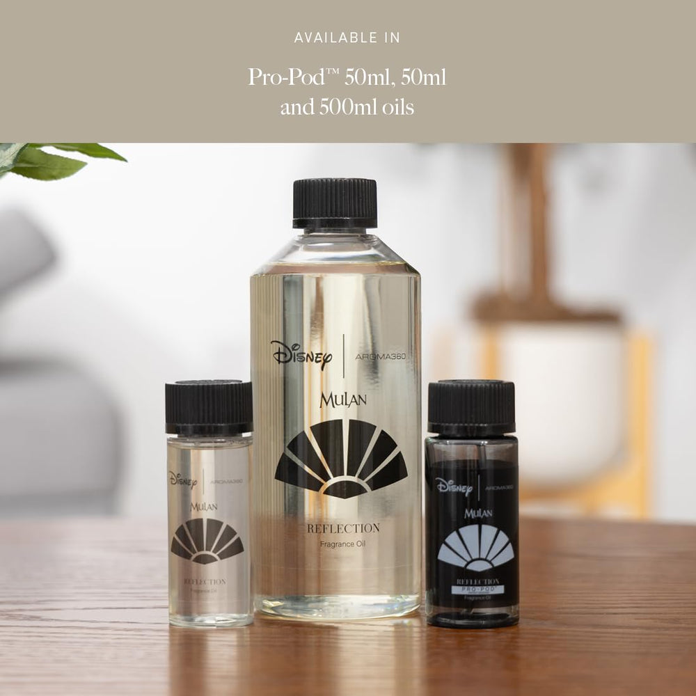 Close-up of Aroma360 fragrance oil bottle with gold cap