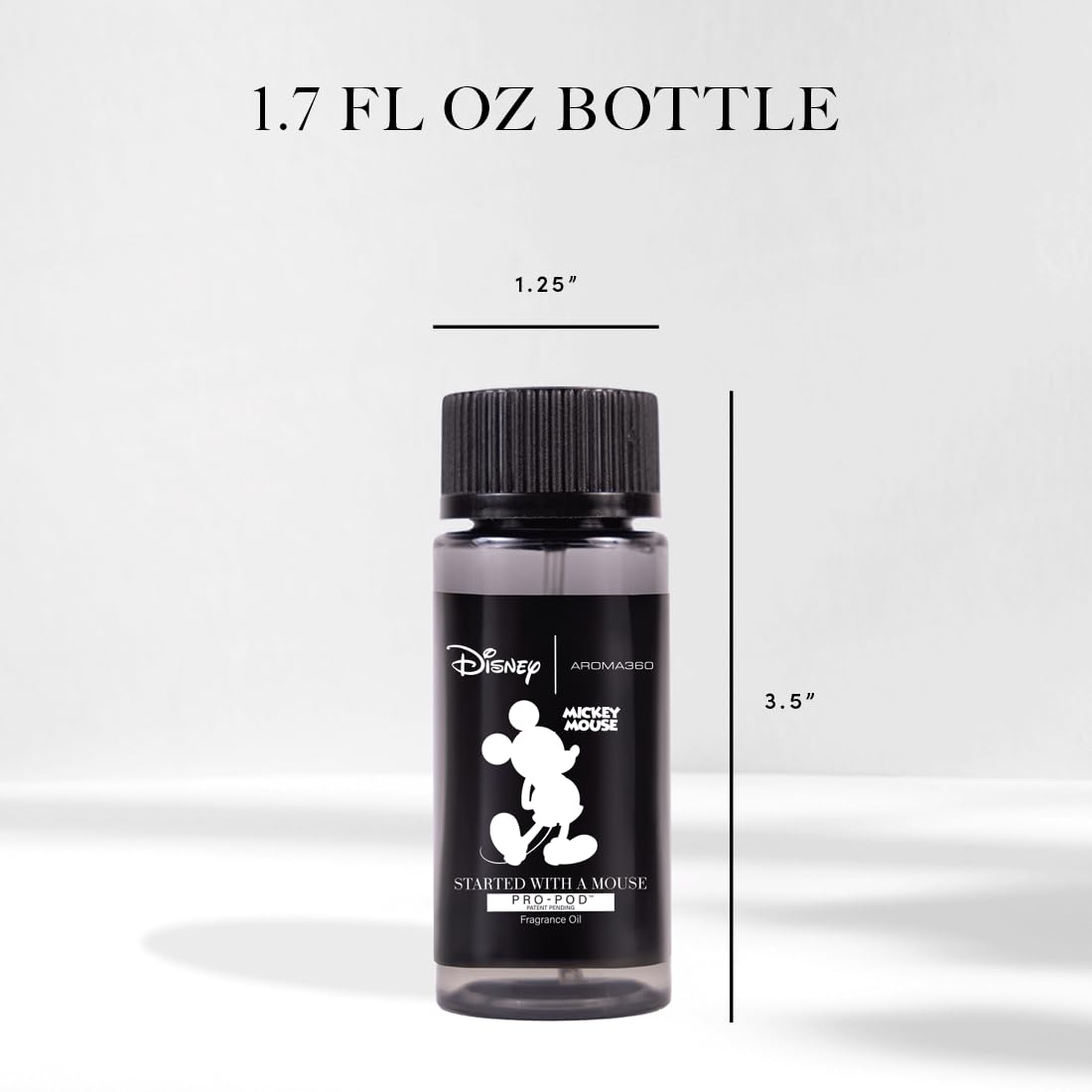 Close-up of Started With A Mouse fragrance oil bottle with lemon and bergamot notes