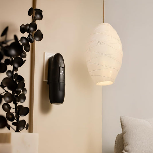Two AromaPlan diffusers plugged into wall outlets