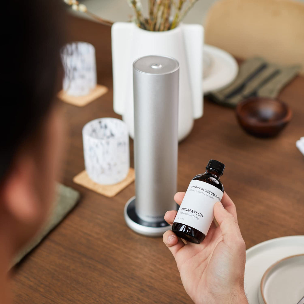 500ml AromaTech aroma oil bottle beside a diffuser