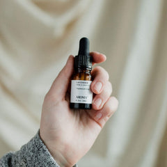 Dropper pouring Aromatech Lavender oil into diffuser