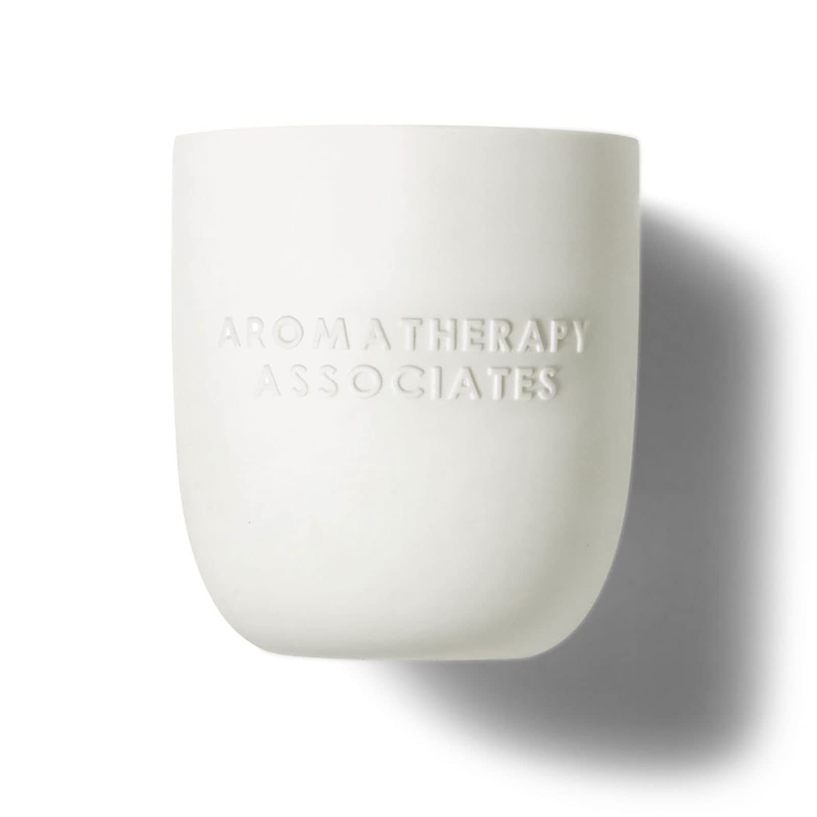 Aromatherapy Associates Deep Relax Candle scent diffusion in a bedroom setting