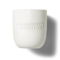 Aromatherapy Associates Deep Relax Candle scent diffusion in a bedroom setting