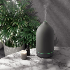 Elegant grey ceramic essential oil diffuser as a modern living room accent