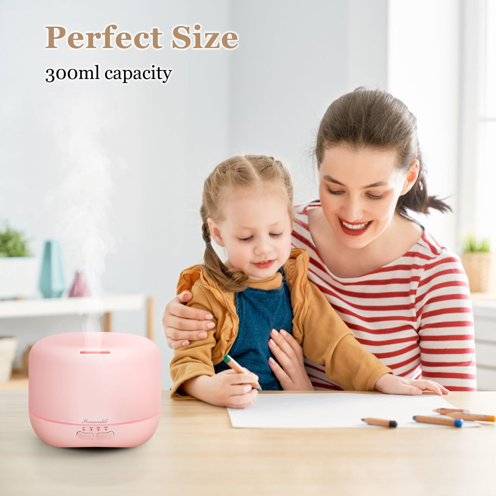 Pink diffuser illuminating mist in a cozy room
