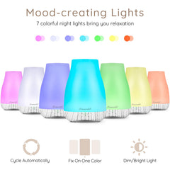 Portable mini diffuser on a desk with office accessories