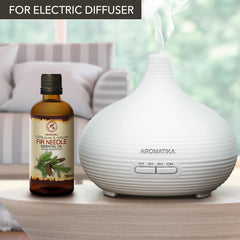 AROMATIKA Fir Needle Essential Oil forest-scene captures cozy, nature-inspired ambience.