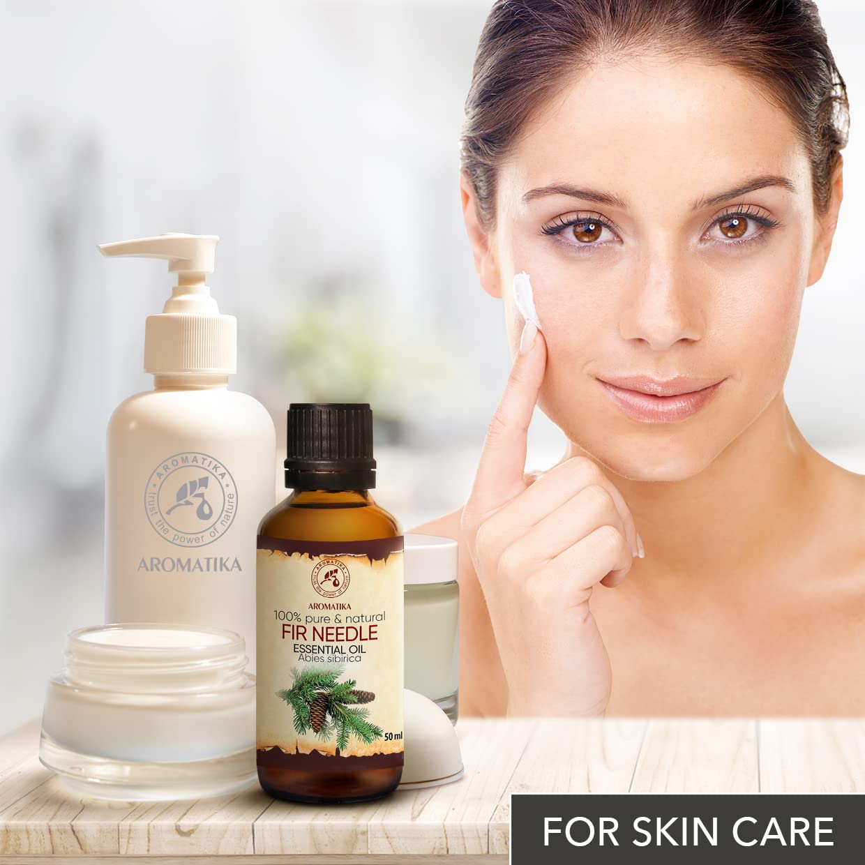 AROMATIKA Fir Needle Oil massage application offering soothing, aromatic massage prep.
