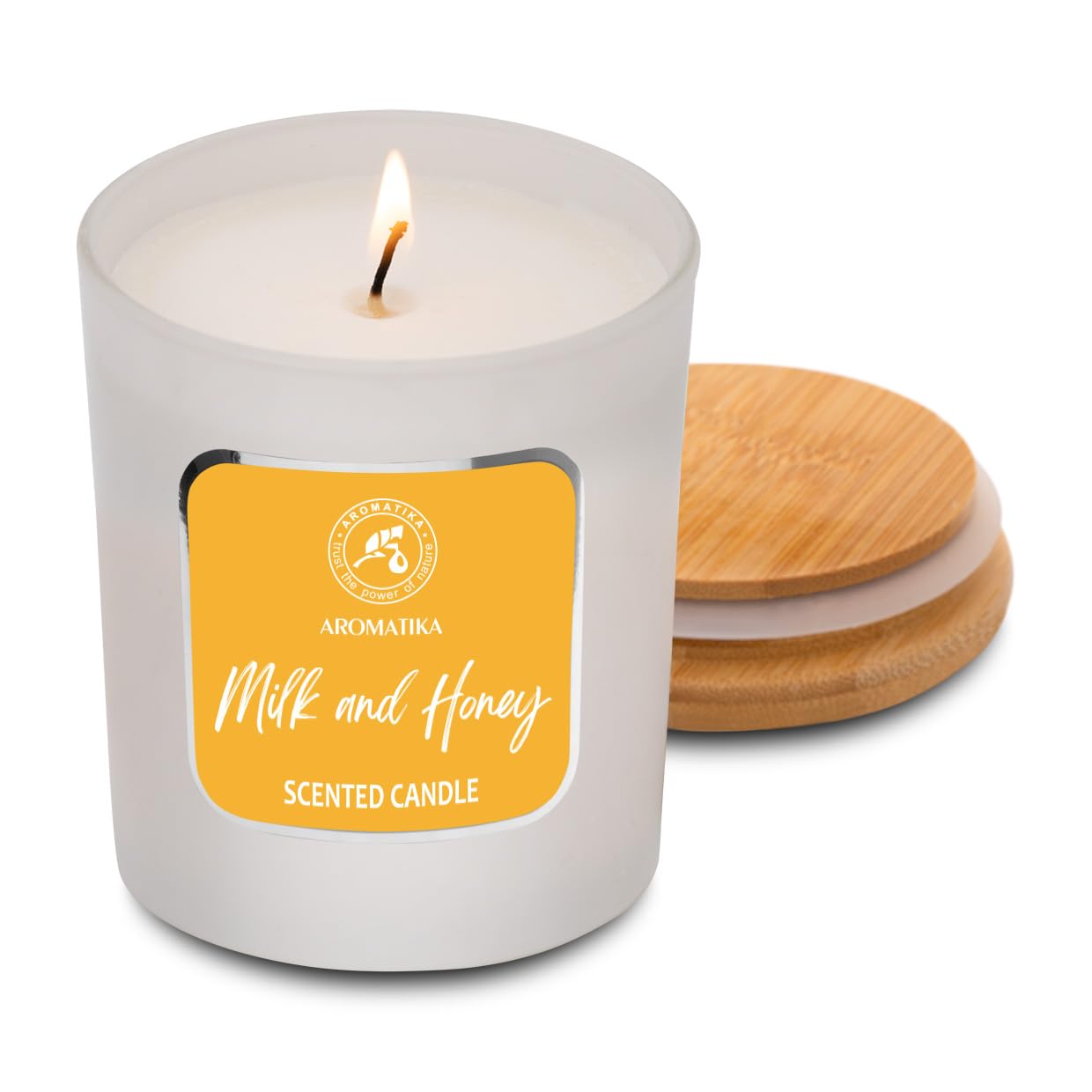 AROMATIKA Milk & Honey candle lit to create cozy, relaxing evenings.