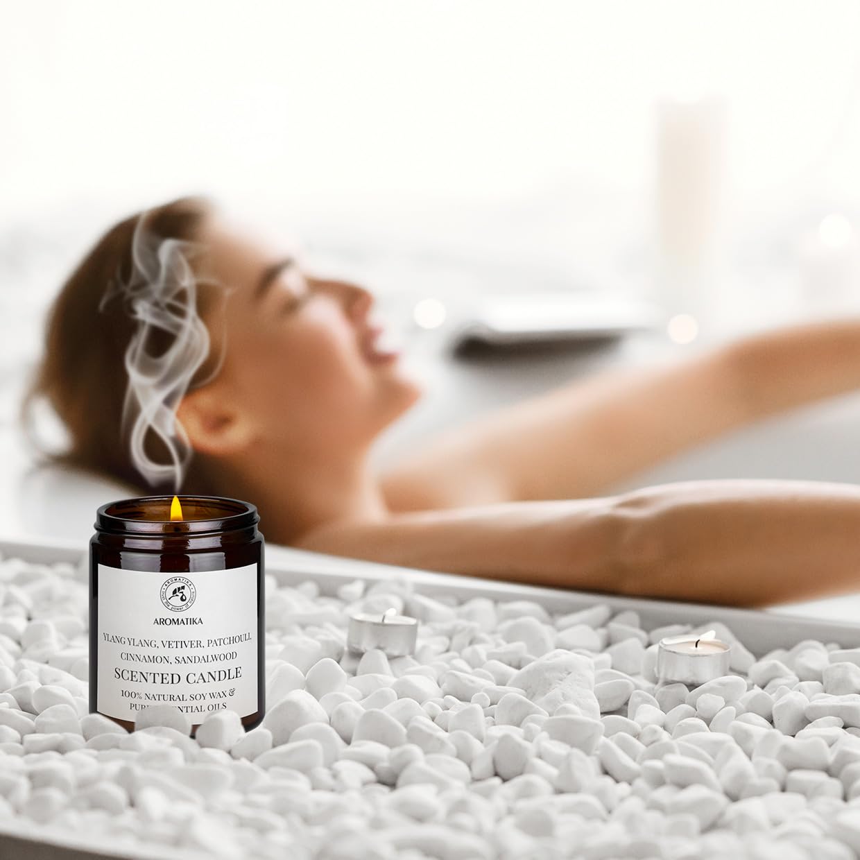 AROMATIKA scented candle warm-ambience on table signifies inviting atmosphere.