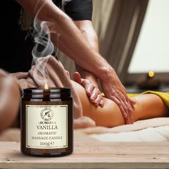 AROMATIKA Scented Massage Candle Vanilla sits in a cozy setting, ideal for gifting on birthdays or holidays.