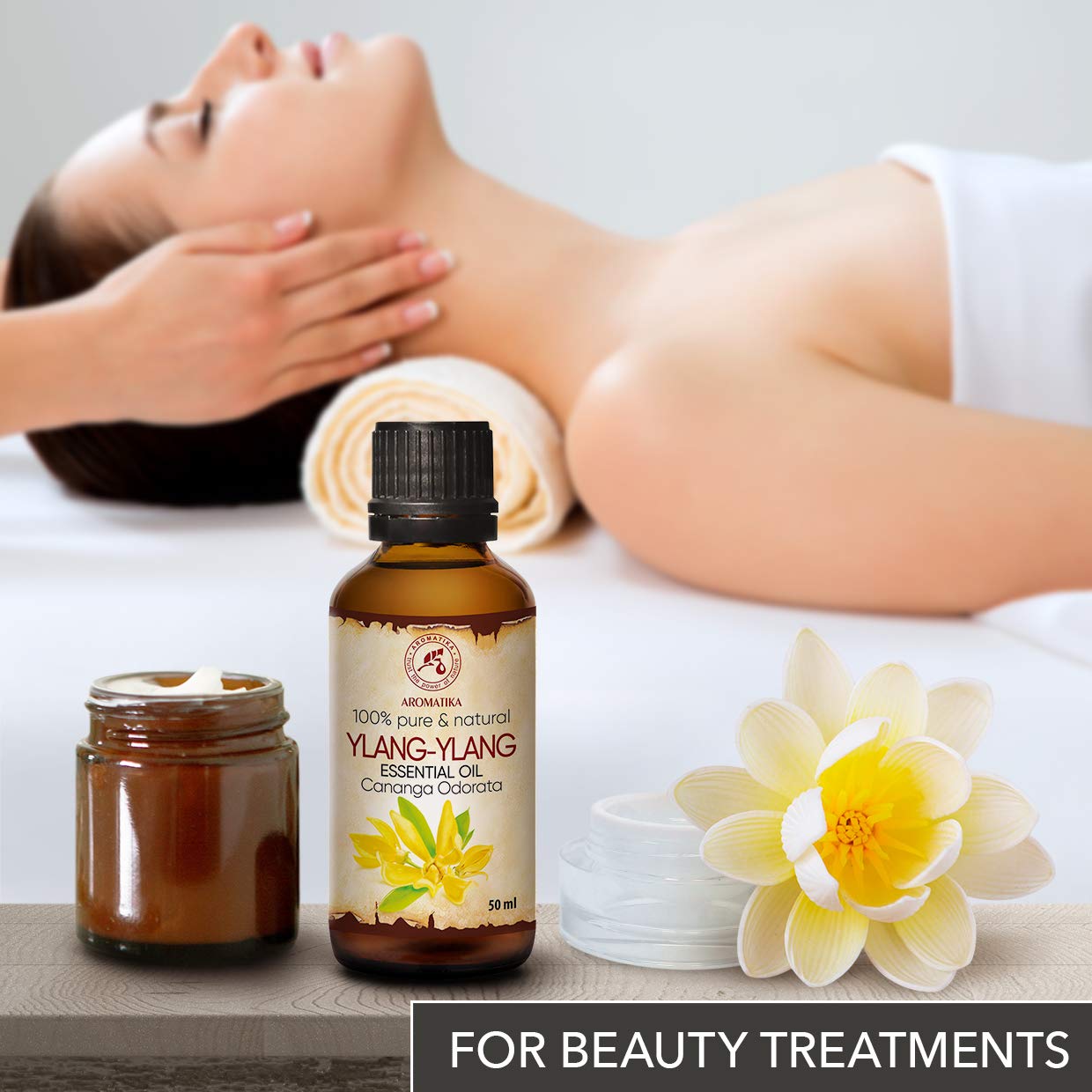 AROMATIKA Ylang-Ylang oil amber bottle conveys purity and premium storage.