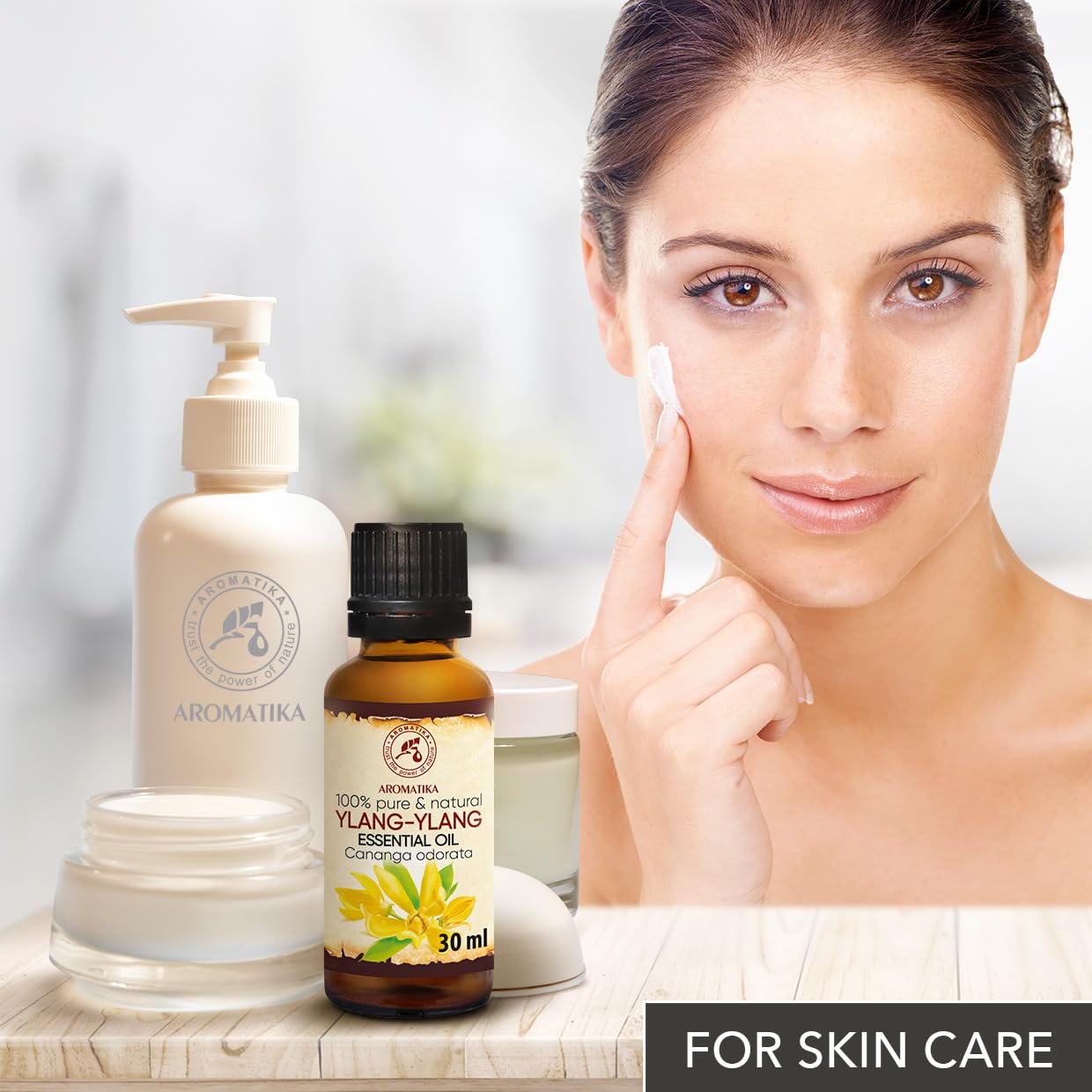 AROMATIKA Ylang Ylang oil after sun exposure skin care concept.
