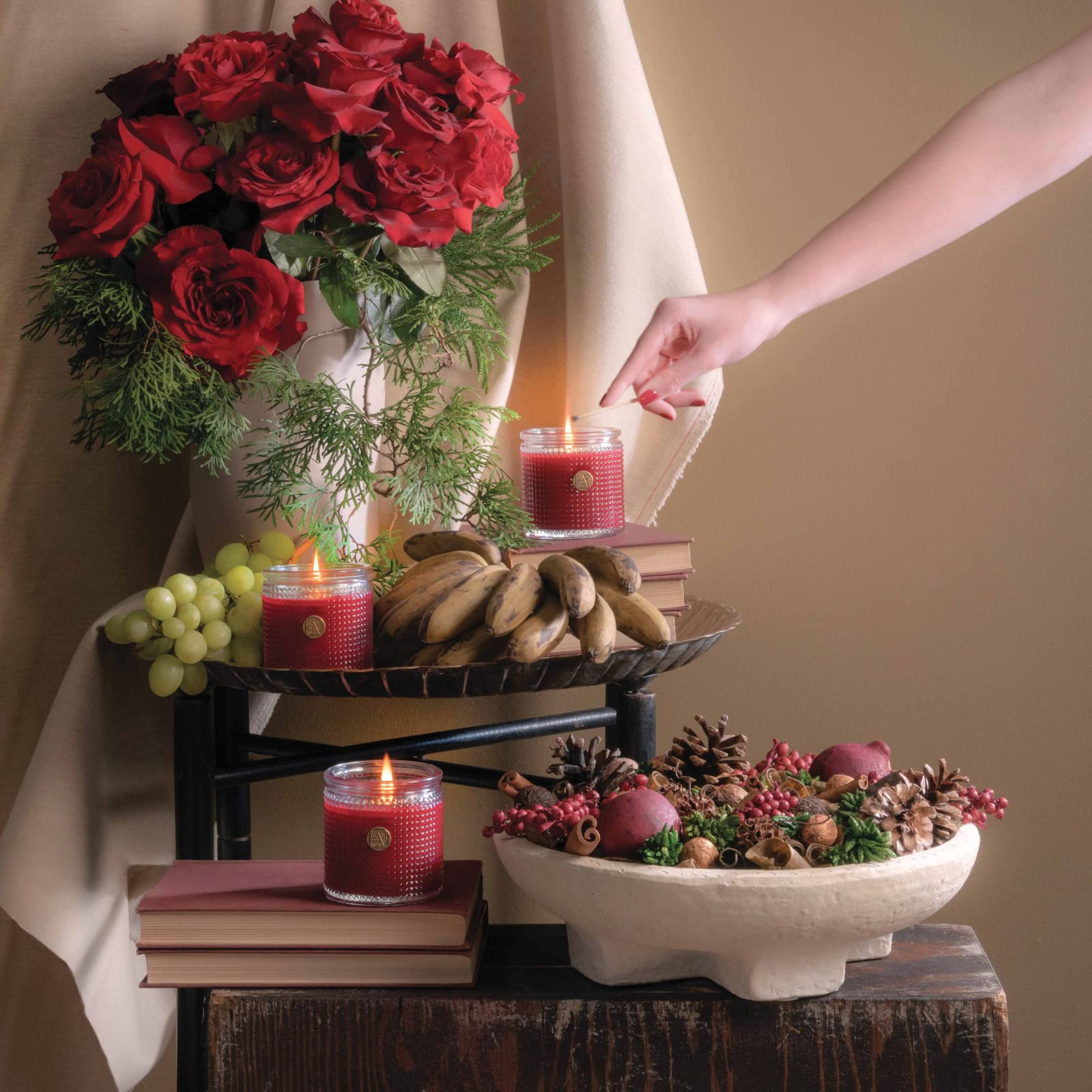 Lit Aromatique candle The Smell of Christmas with warm glow