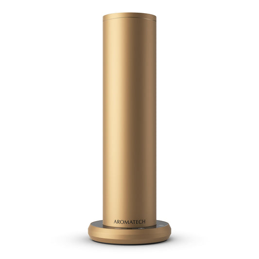 AromaTech AroMini BT Plus Gold Scent Diffuser on a modern living room shelf