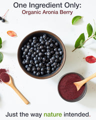 Aronia berry powder being dispensed from a jar