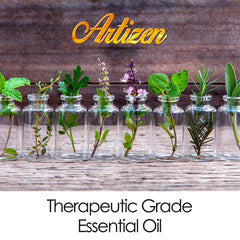 Lavender sprigs beside a 2 fl oz bottle of Artizen Lavender Essential Oil.