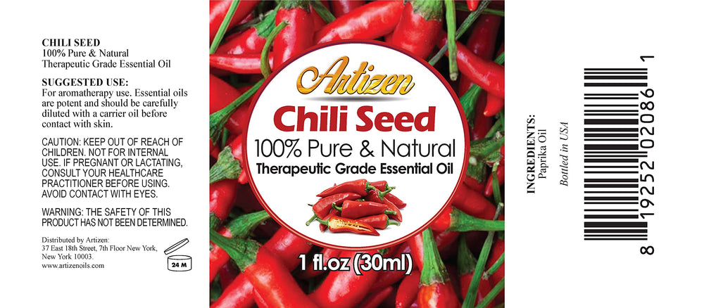 Close-up of chili seed essential oil in glass bottle