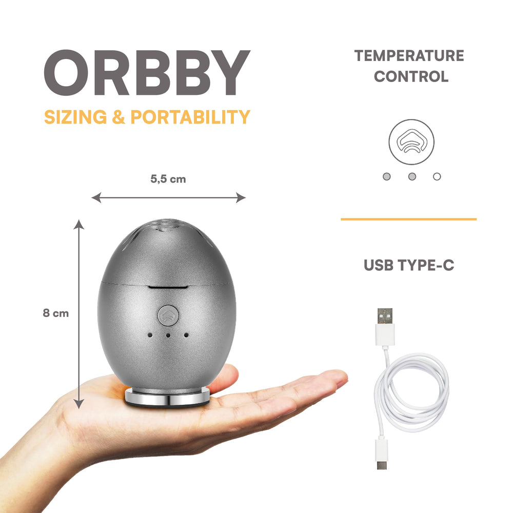 Artronic Orbby compact travel diffuser on a desk for on-the-go scent
