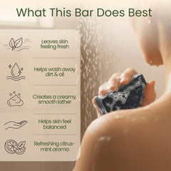 Close-up texture of Aspen Kay Naturals Dead Sea mud soap bar with charcoal specks.