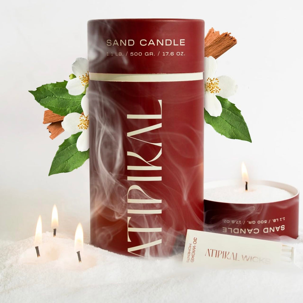 Atipikal Sand Candle 18oz with Saldalwood Jasmine scent floating on water