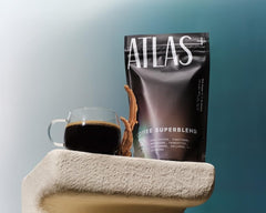 Atlas Coffee Club mug beside bag, ready for morning ritual and focus.