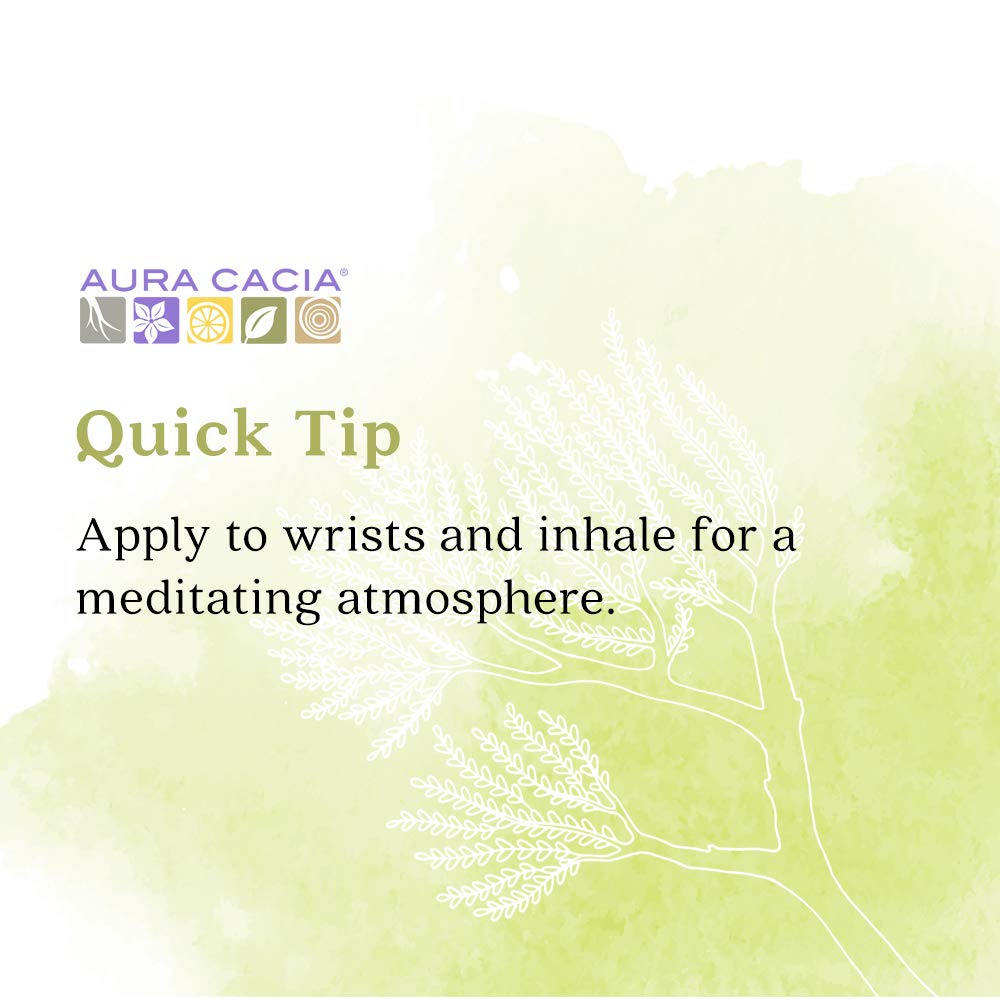Hands applying Frankincense Roll-On to wrists for inhalation
