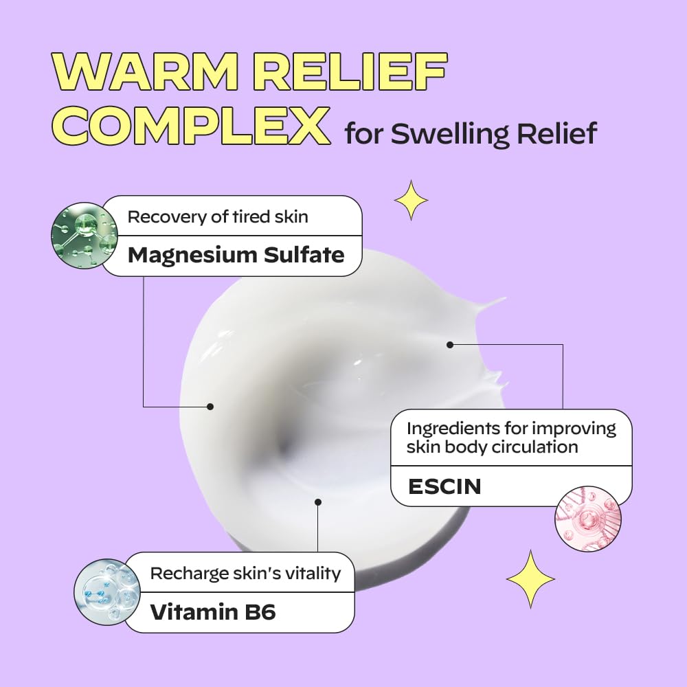 Gua sha tool gliding over calf with massage cream
