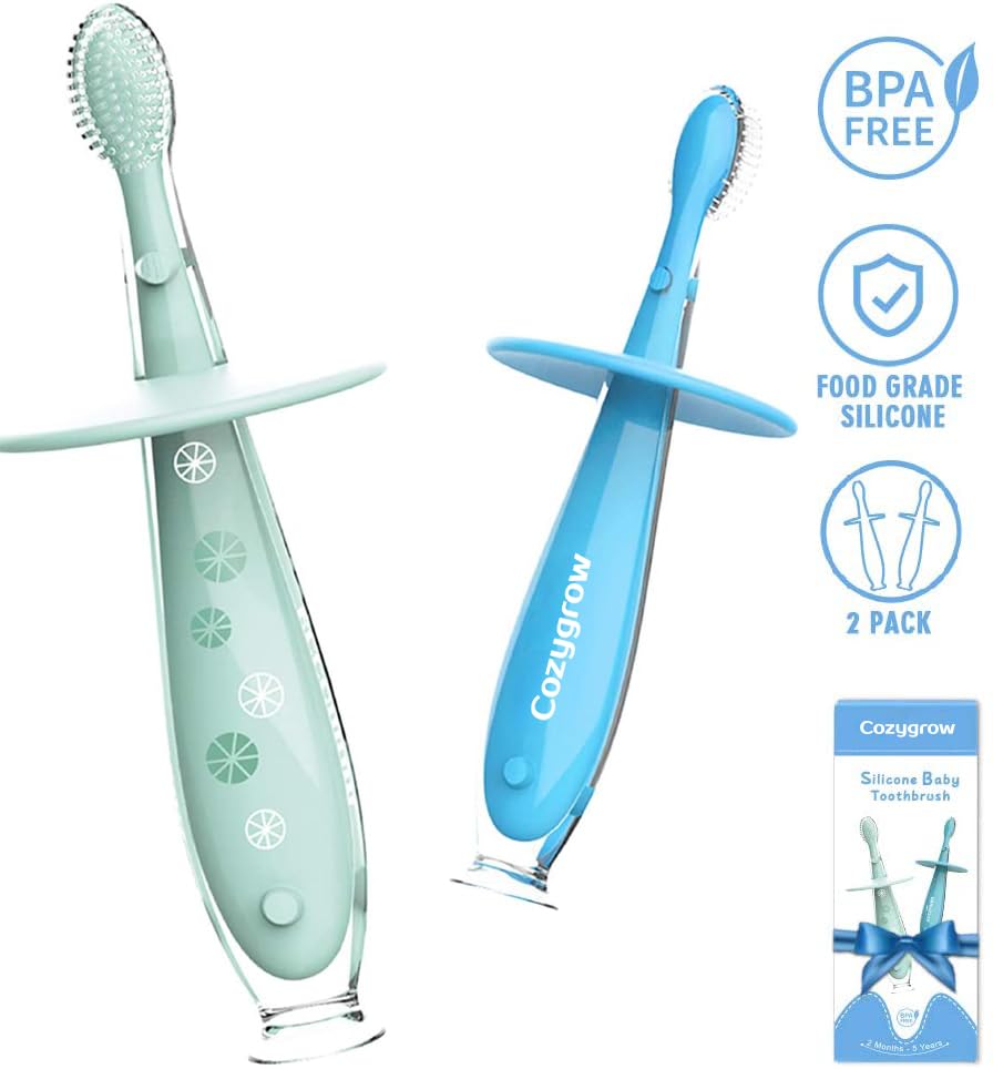 Baby brushing teeth with suction base toothbrush