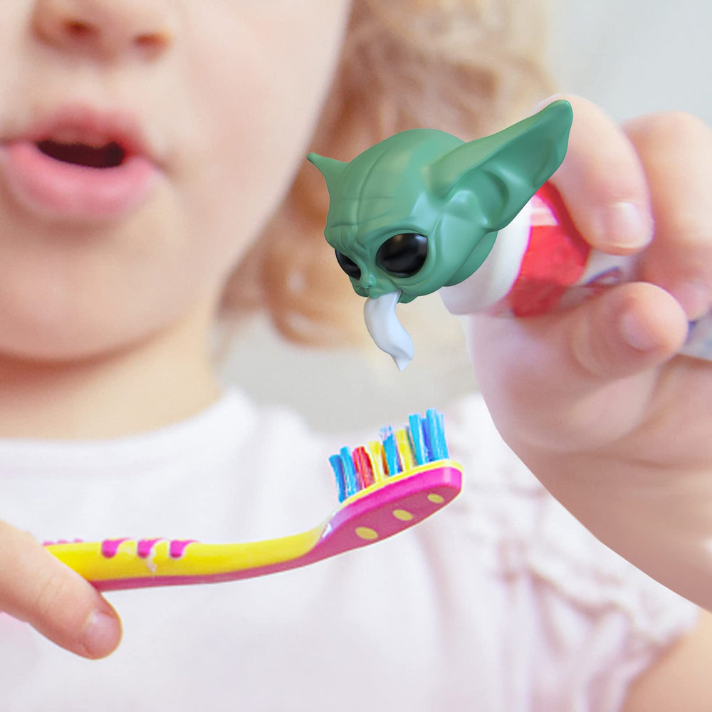 Close-up of Baby Yoda toothpaste cap with eyes and smile