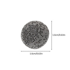 Hand holding a lava stone diffuser to release essential oil
