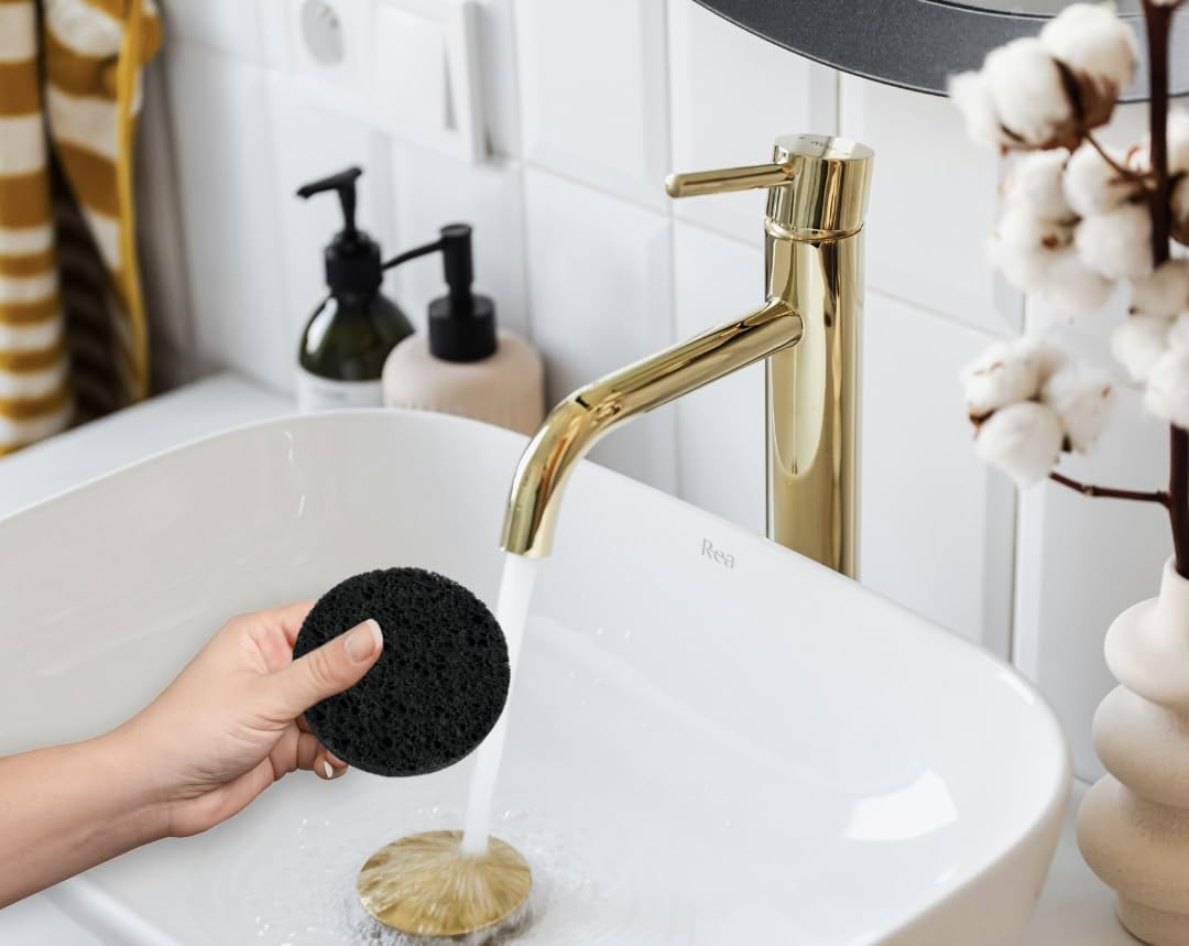 Bamboo Charcoal Cleansing Sponge material closeup reveals wood pulp fibers and charcoal infusion.